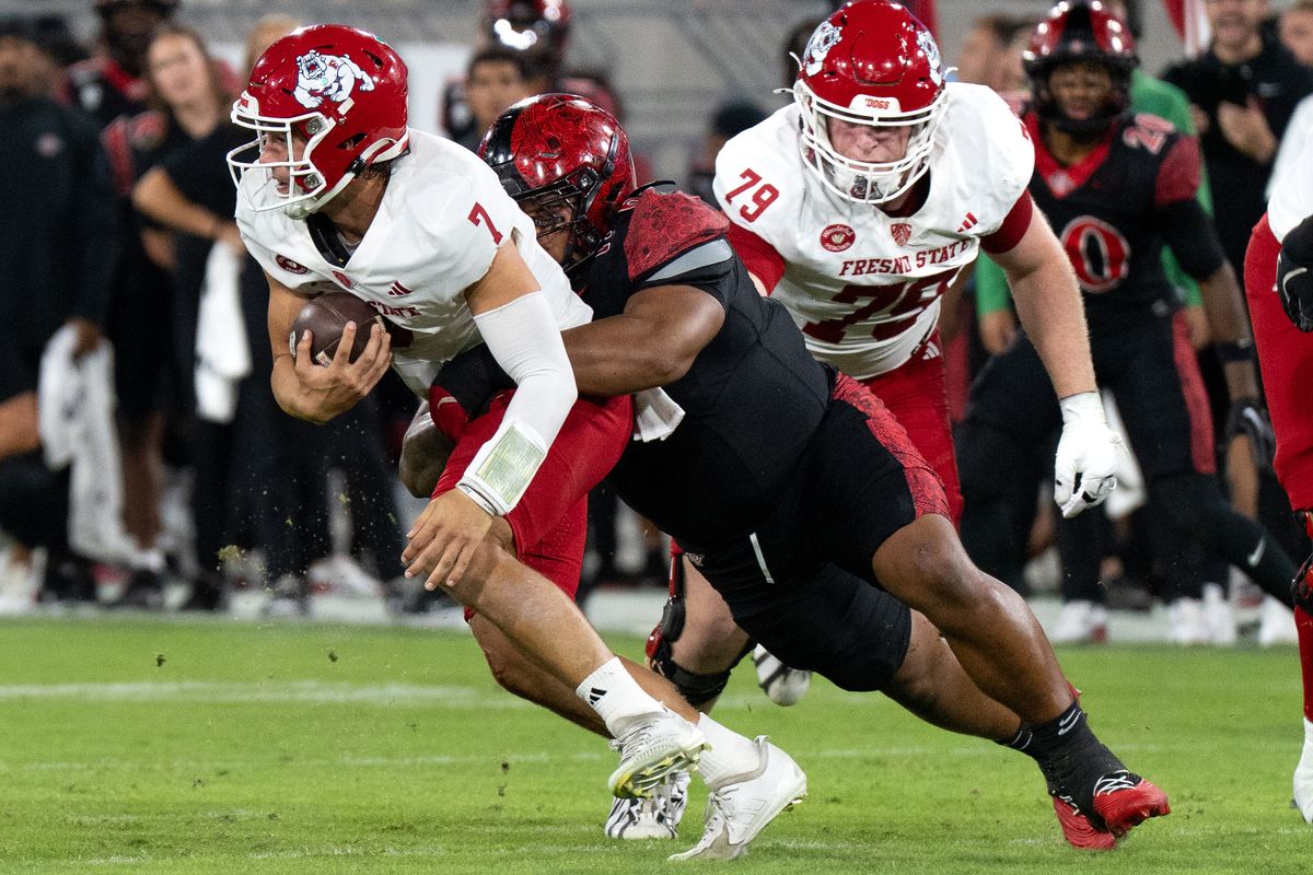 San Diego State University defensive lineman Malachi Finau (6) sacks Fresno State quarterback Jayden Mandal (7) during a PAC-12 football game against Fresno State, Saturday October 17, 2026 in San Diego, California. San Diego State University defensive lineman Malachi Finau (6) sacks Fresno State quarterback Jayden Mandal (7) during a PAC-12 football game against Fresno State, Saturday October 17, 2026 in San Diego, California.
