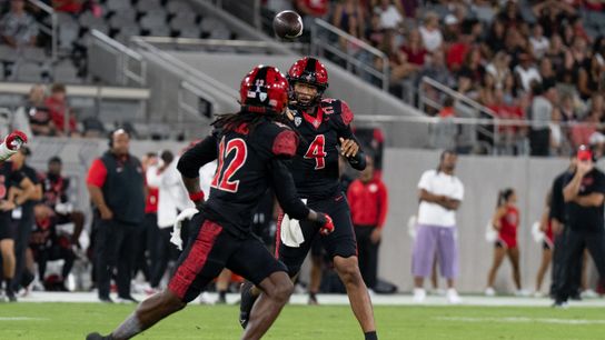San Diego State University quarterback Jayden Denegal (4) throws the ball to San Diego State University wide receiver Jaylon Hawkins (12) during a PAC-12 football game against Fresno State, Saturday October 17, 2026 in San Diego, California. San Diego State University quarterback Jayden Denegal (4) throws the ball to San Diego State University wide receiver Jaylon Hawkins (12) during a PAC-12 football game against Fresno State, Saturday October 17, 2026 in San Diego, California.