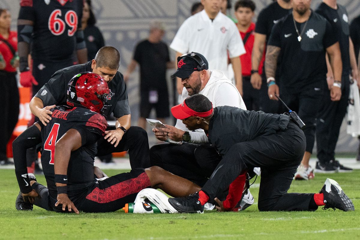 San Diego State University quarterback Jayden Denegal (4) goes down in pain during a PAC-12 football game against Fresno State, Saturday October 17, 2026 in San Diego, California. San Diego State University quarterback Jayden Denegal (4) goes down in pain during a PAC-12 football game against Fresno State, Saturday October 17, 2026 in San Diego, California.