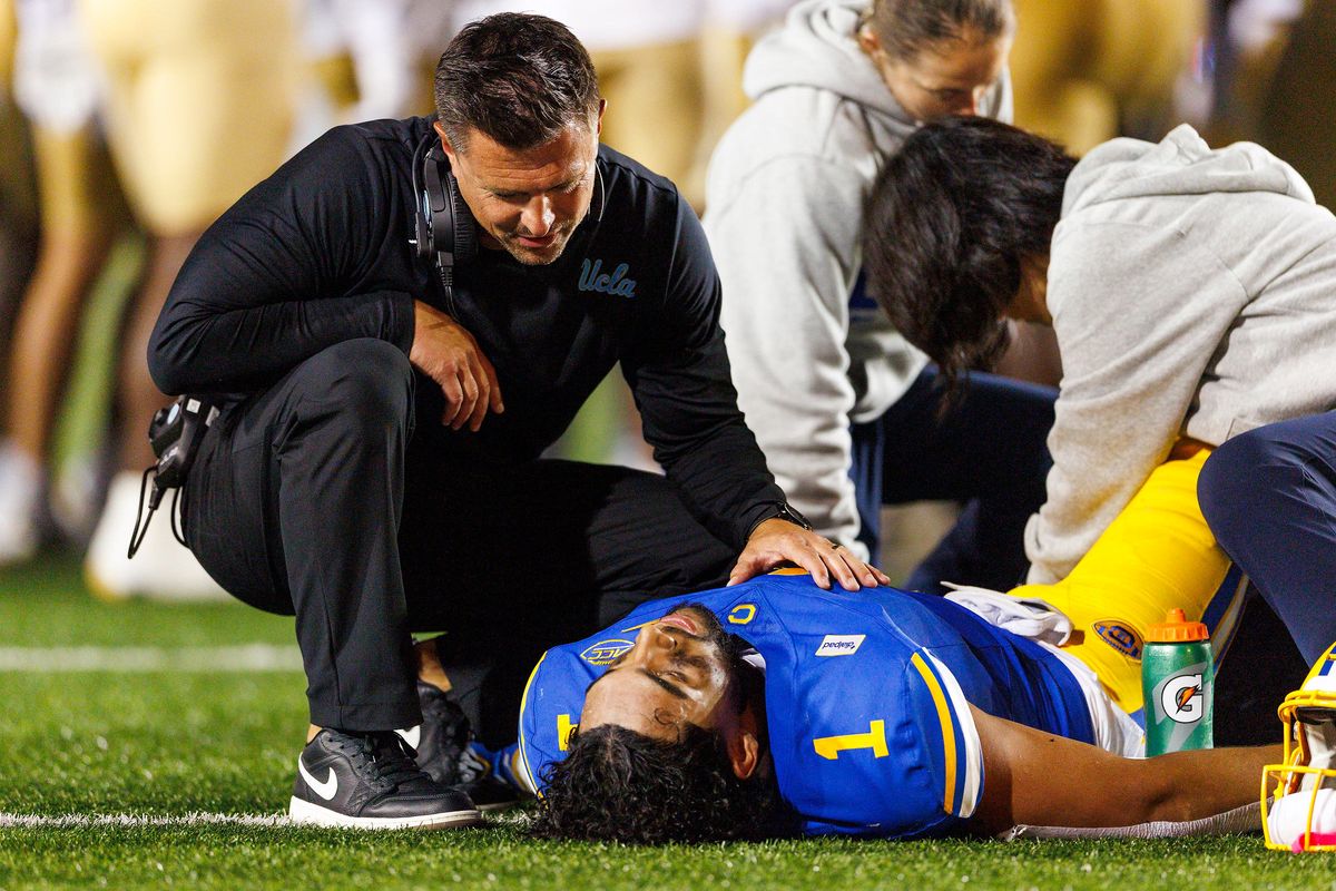 Bob Chesney of the UCLA Bruins comforts Carter Vargas #1 of the Cal Golden Bears during the game at California Memorial Stadium on September 5, 2026 in Berkeley, California. Bob Chesney of the UCLA Bruins comforts Carter Vargas #1 of the Cal Golden Bears during the game at California Memorial Stadium on September 5, 2026 in Berkeley, California.