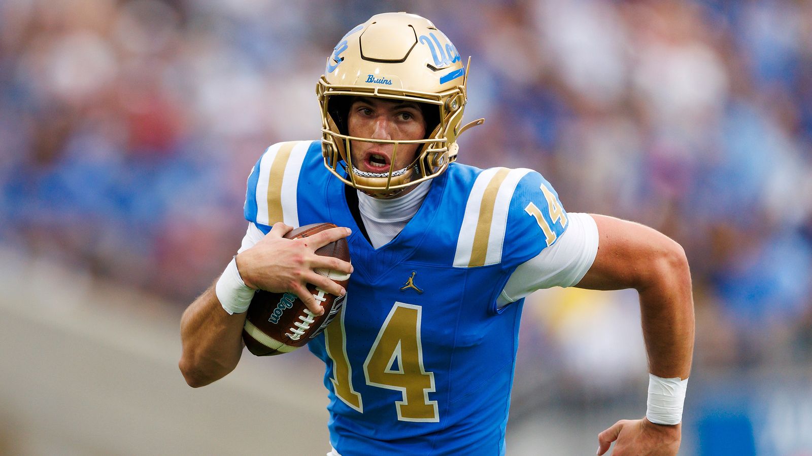 Ty Dieffenbach #14 of the UCLA Bruins runs with the ball during the game against Wisconsin Badgers at Rose Bowl Stadium on October 17, 2026 in Pasadena, California. Ty Dieffenbach #14 of the UCLA Bruins runs with the ball during the game against Wisconsin Badgers at Rose Bowl Stadium on October 17, 2026 in Pasadena, California.