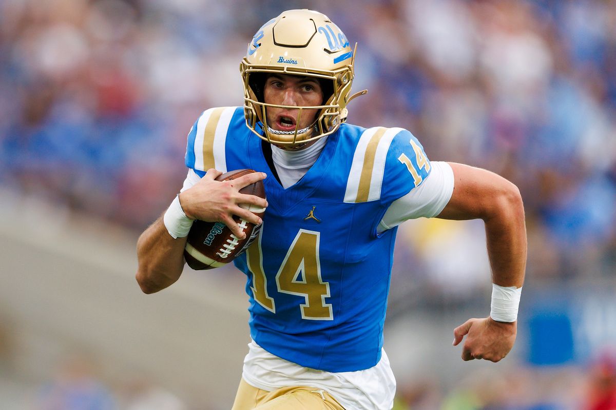 Ty Dieffenbach #14 of the UCLA Bruins runs with the ball during the game against Wisconsin Badgers at Rose Bowl Stadium on October 17, 2026 in Pasadena, California. Ty Dieffenbach #14 of the UCLA Bruins runs with the ball during the game against Wisconsin Badgers at Rose Bowl Stadium on October 17, 2026 in Pasadena, California.