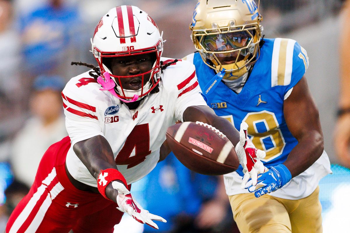Malachi Coleman #4 of the Wisconsin Badgers dives for the ball during the game against UCLA Bruins at Rose Bowl Stadium on October 17, 2026 in Pasadena, California. Malachi Coleman #4 of the Wisconsin Badgers dives for the ball during the game against UCLA Bruins at Rose Bowl Stadium on October 17, 2026 in Pasadena, California.