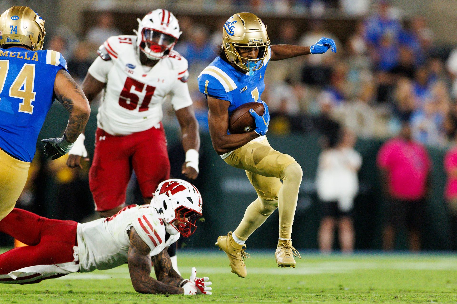 Aidan Mizell #1 of the UCLA Bruins runs after the catch during the game against Wisconsin Badgers at Rose Bowl Stadium on October 17, 2026 in Pasadena, California. Aidan Mizell #1 of the UCLA Bruins runs after the catch during the game against Wisconsin Badgers at Rose Bowl Stadium on October 17, 2026 in Pasadena, California.