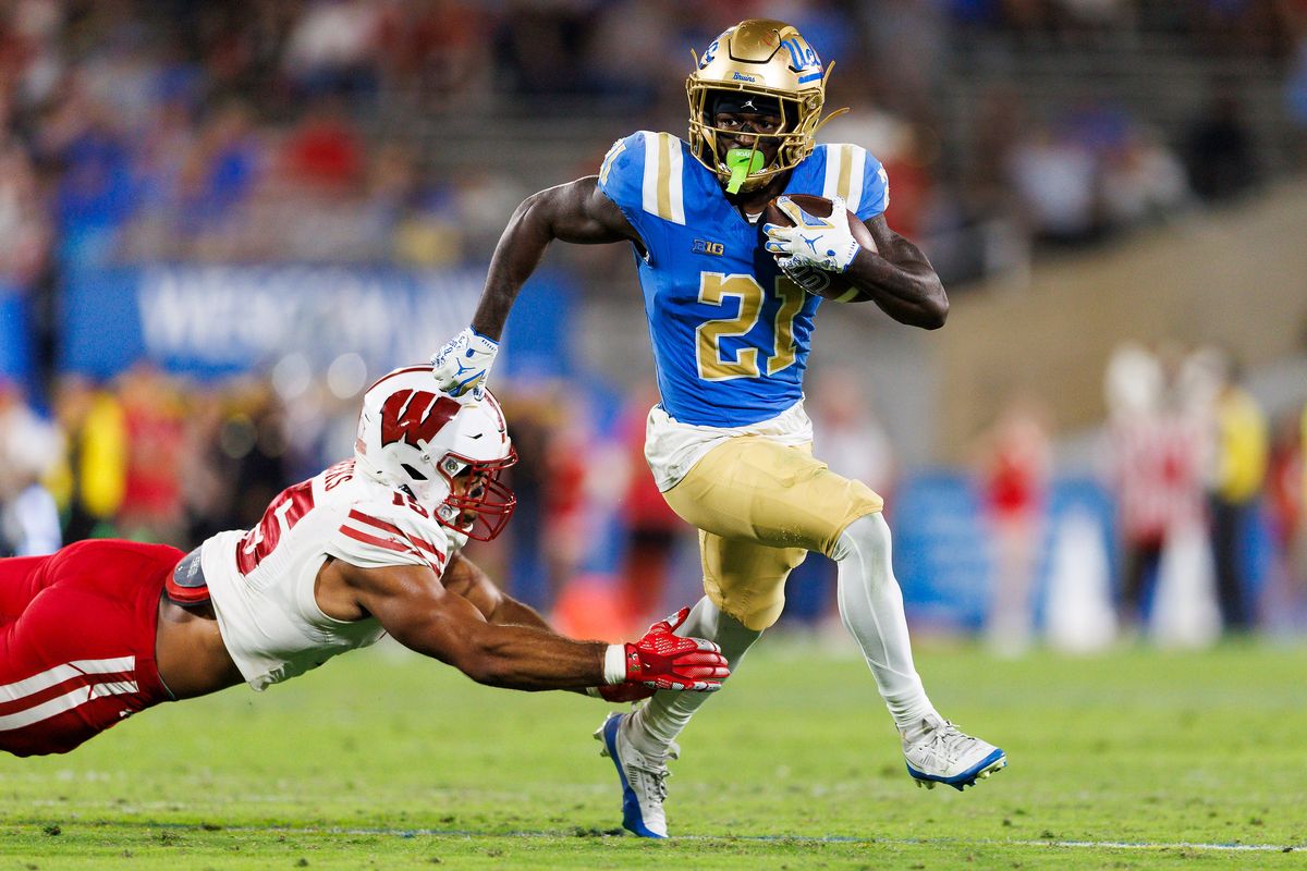 Jaivian Thomas #21 of the UCLA Bruins runs with the ball during the game against Wisconsin Badgers at Rose Bowl Stadium on October 17, 2026 in Pasadena, California. Jaivian Thomas #21 of the UCLA Bruins runs with the ball during the game against Wisconsin Badgers at Rose Bowl Stadium on October 17, 2026 in Pasadena, California.