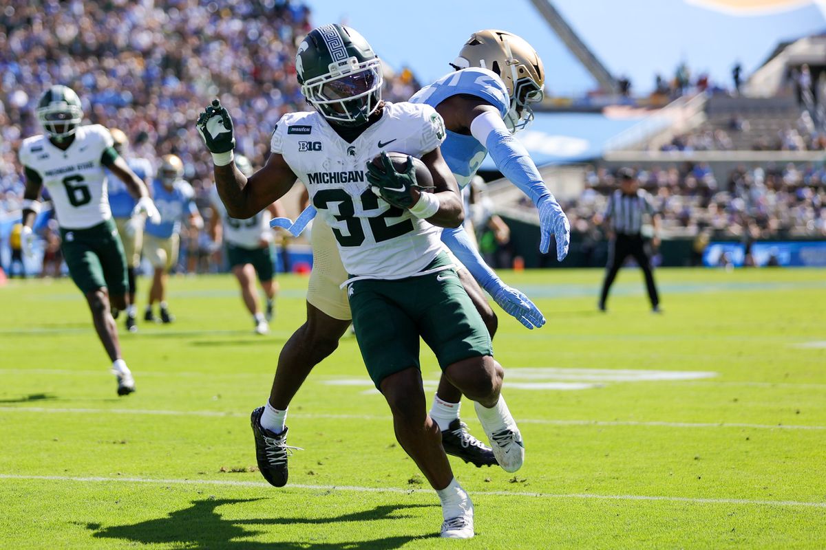 Kenneth Williams #32 of the Michigan State Spartans runs in a touchdown during the game against the UCLA Bruins at Rose Bowl Stadium on October 24, 2026 in Pasadena, California. Kenneth Williams #32 of the Michigan State Spartans runs in a touchdown during the game against the UCLA Bruins at Rose Bowl Stadium on October 24, 2026 in Pasadena, California.
