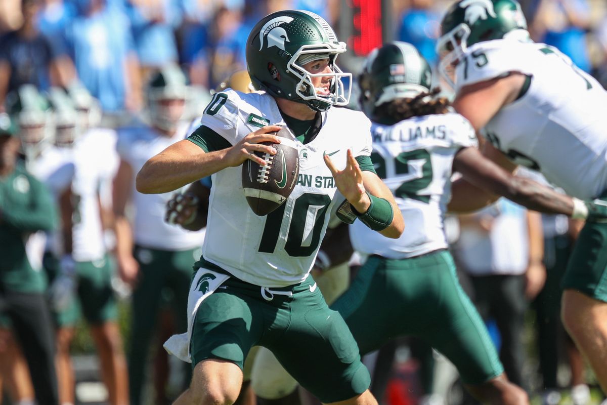 Kayd Coffman #10 of the Michigan State Spartans drops back in the pocket during the game against the UCLA Bruins at Rose Bowl Stadium on October 24, 2026 in Pasadena, California. Kayd Coffman #10 of the Michigan State Spartans drops back in the pocket during the game against the UCLA Bruins at Rose Bowl Stadium on October 24, 2026 in Pasadena, California.