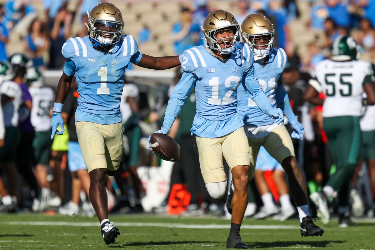 Malik Hartford #12 of the UCLA Bruins celebrates an interception with teammates during the game against the Michigan State Spartans at Rose Bowl Stadium on October 24, 2026 in Pasadena, California. Malik Hartford #12 of the UCLA Bruins celebrates an interception with teammates during the game against the Michigan State Spartans at Rose Bowl Stadium on October 24, 2026 in Pasadena, California.