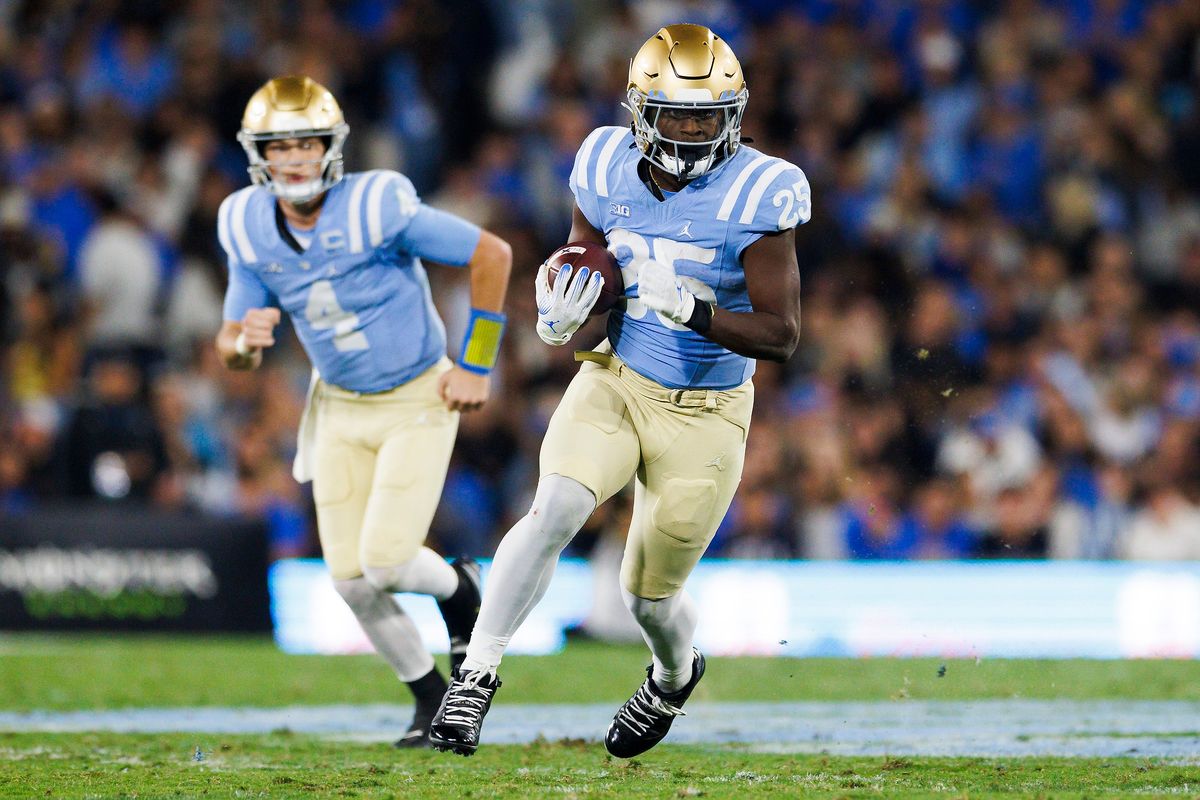 T.J. Harden #25 of the UCLA Bruins runs with the ball during the first half game against Iowa Hawkeyes at Rose Bowl Stadium on November 8, 2024 in Pasadena, California. 