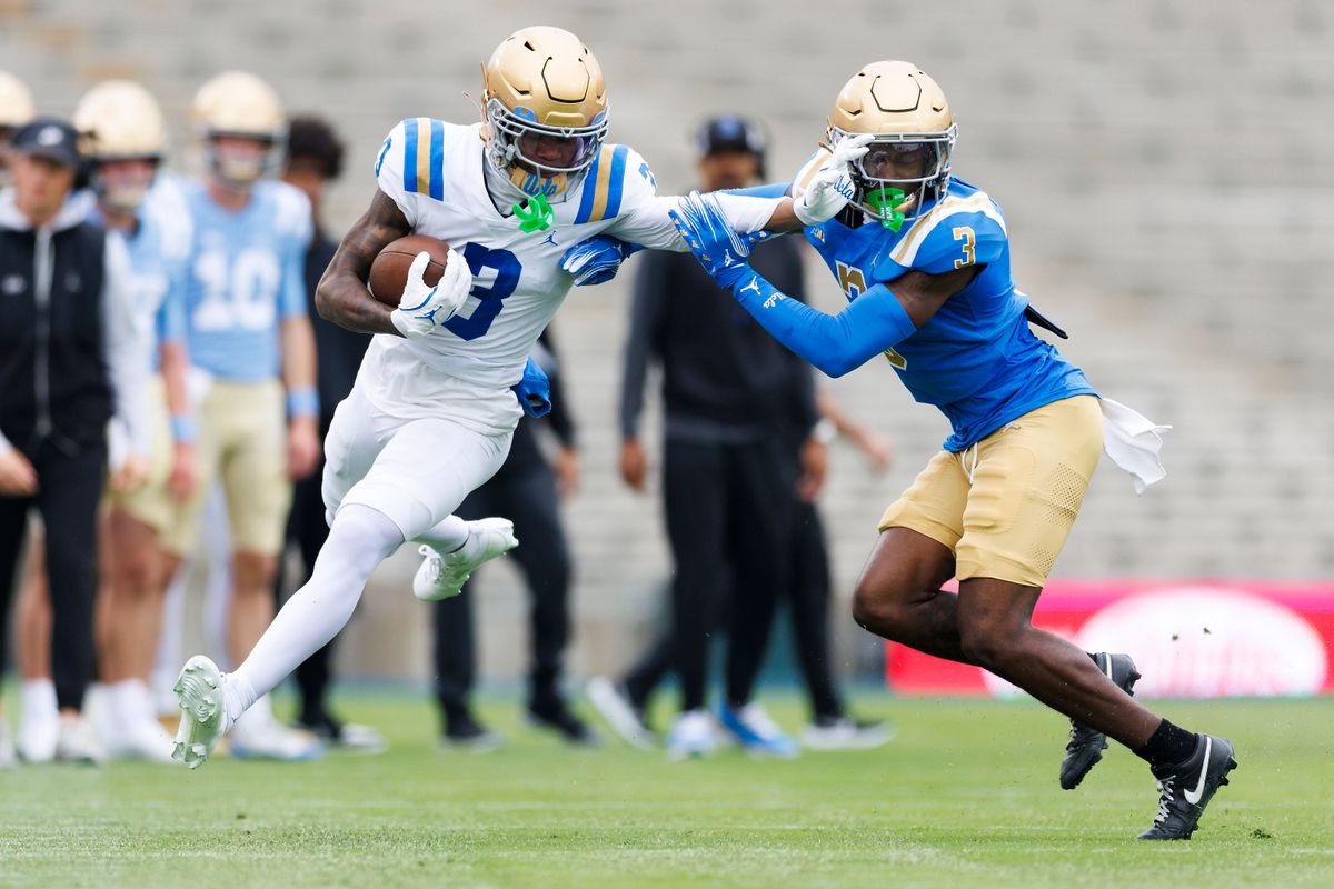 Kwazi Gilmer #3 straight arms Robert Stafford #3 during the UCLA Football Spring Showcase at Rose Bowl Stadium on May 3, 2025 in Pasadena, California. 