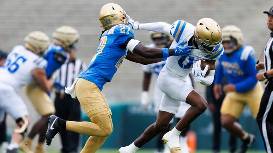 Jaedon Wilson #11 straight arms Jadyn Hudson #27 during the UCLA Football Spring Showcase at Rose Bowl Stadium on May 3, 2025 in Pasadena, California. Jaedon Wilson #11 straight arms Jadyn Hudson #27 during the UCLA Football Spring Showcase at Rose Bowl Stadium on May 3, 2025 in Pasadena, California.