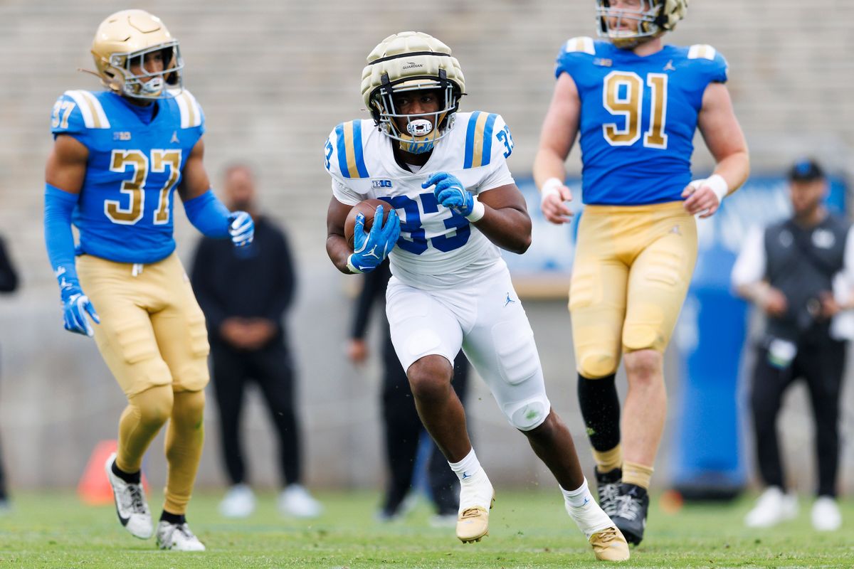 Karson Cox #33 runs with the ball during the UCLA Football Spring Showcase at Rose Bowl Stadium on May 3, 2025 in Pasadena, California. 