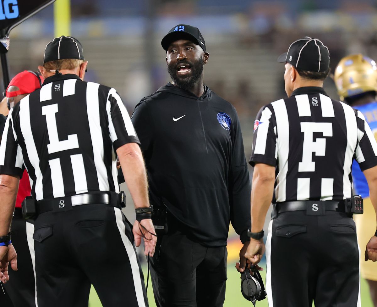 Head coach DeShaun Foster of the UCLA Bruins talks with officials during an NCAA football game against the University of Utah, Saturday August 30, 2025 in Pasadena, CA. Head coach DeShaun Foster of the UCLA Bruins talks with officials during an NCAA football game against the University of Utah, Saturday August 30, 2025 in Pasadena, CA.