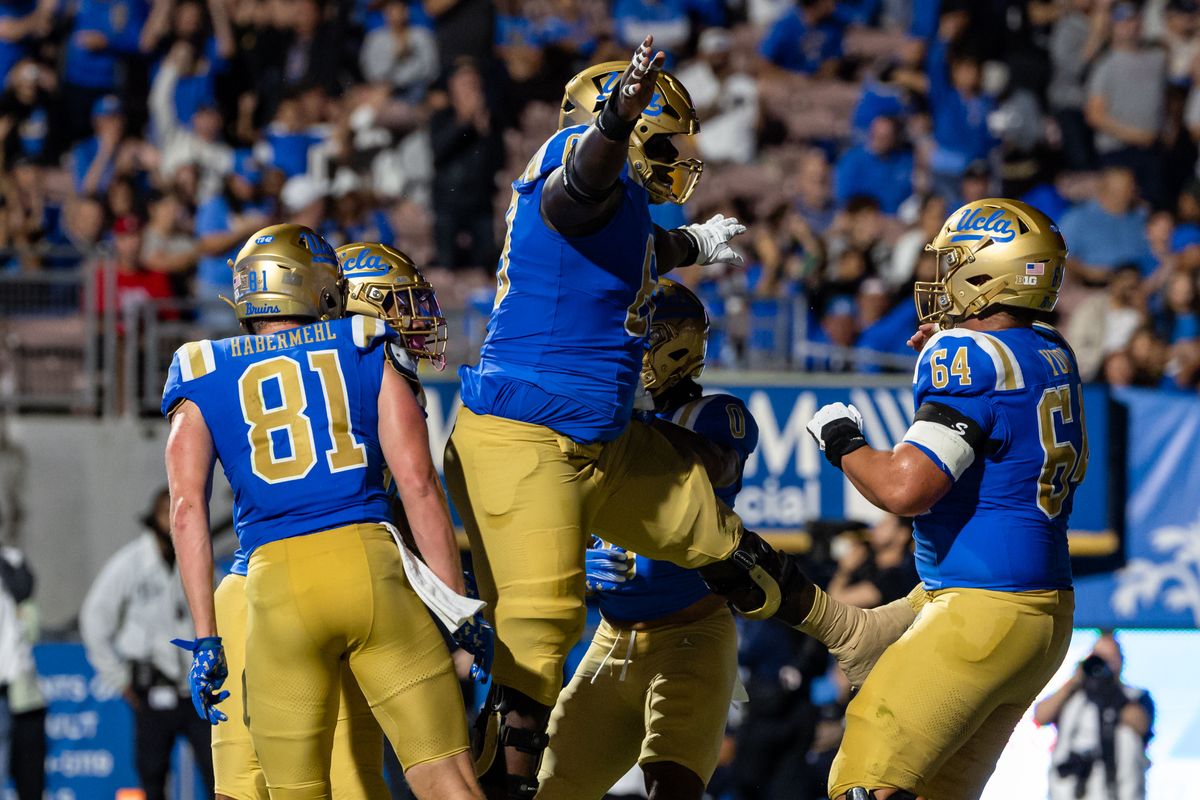 UCLA Bruins players celebrate a touchdown during an NCAA football game against the New Mexico Lobos at the Rose Bowl on September 12, 2025 in Pasadena, California. UCLA Bruins players celebrate a touchdown during an NCAA football game against the New Mexico Lobos at the Rose Bowl on September 12, 2025 in Pasadena, California.