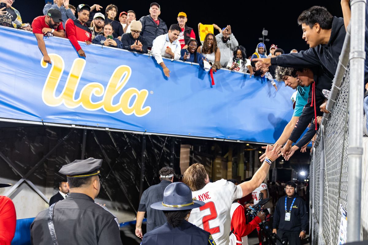 Quarterback Jack Layne #2 of the New Mexico Lobos high fives fans as he leaves the field after an NCAA football game against the UCLA Bruins at the Rose Bowl on September 12, 2025 in Pasadena, California. Quarterback Jack Layne #2 of the New Mexico Lobos high fives fans as he leaves the field after an NCAA football game against the UCLA Bruins at the Rose Bowl on September 12, 2025 in Pasadena, California.