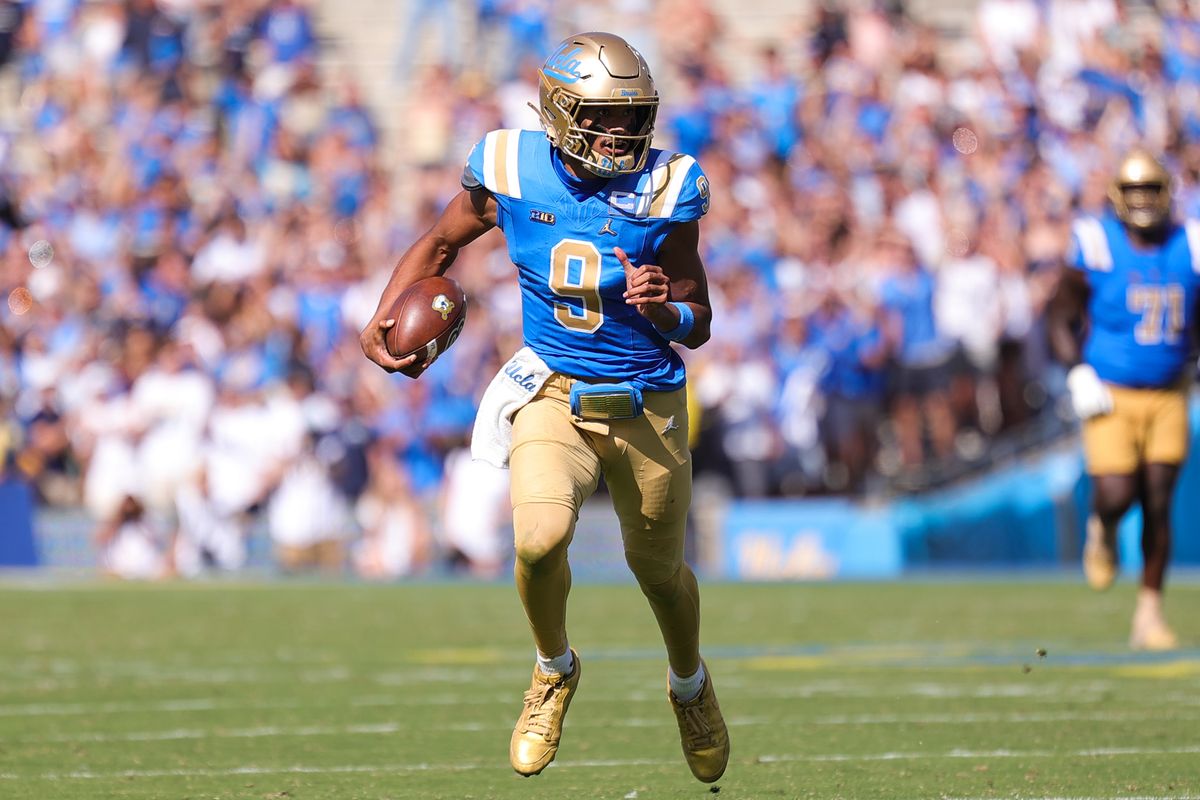 #9 Nico Iamaleava of UCLA carries the football upfield during an NCAA football game against Penn State on October 4, 2025 in Pasadena, CA.