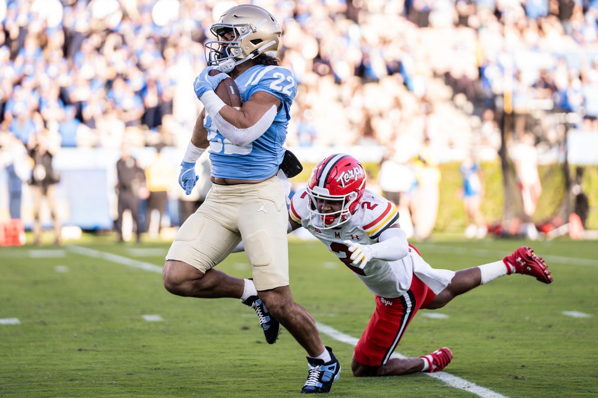 #6 Anthony Woods of UCLA carries the football upfield during an NCAA football game against Penn State on October 18, 2025 in Pasadena, CA.