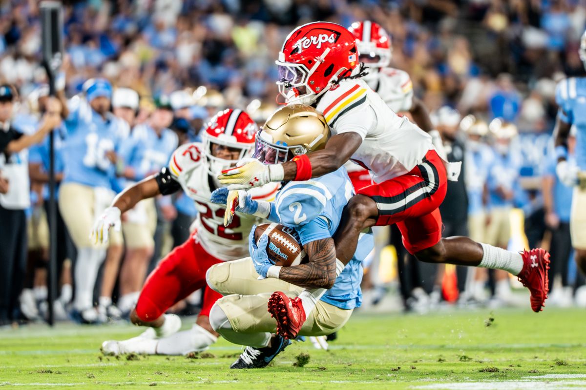 #2 Titus Mokiao-Atimalala of UCLA gets tackled by his helmet during an NCAA football game against Maryland Terrapinson October 18, 2025 in Pasadena, CA.