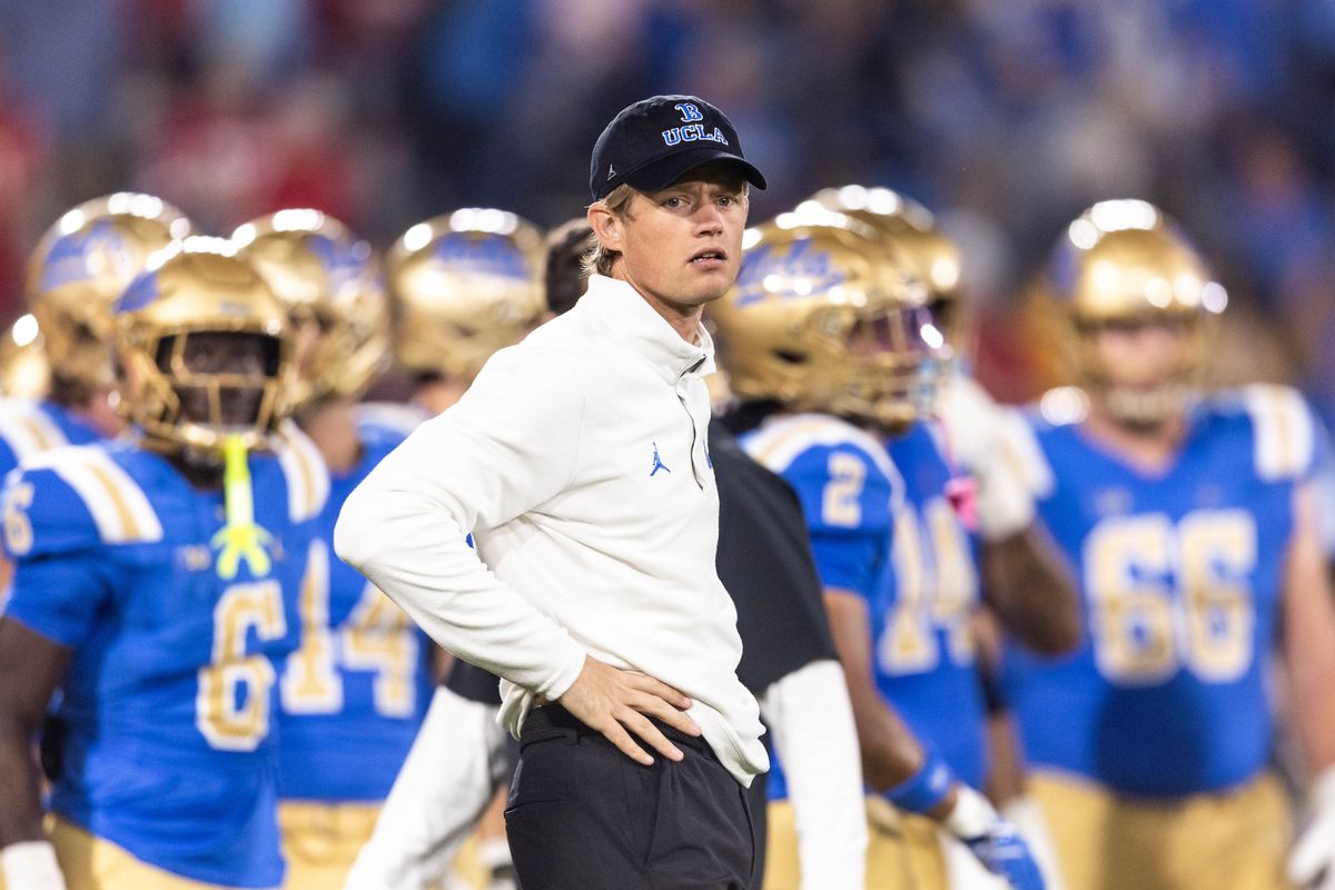 UCLA Bruins offensive coordinator Jerry Neuheisel prepares before the game against Nebraska Cornhuskers at Rose Bowl Stadium on November 8, 2025 in Pasadena, California. 