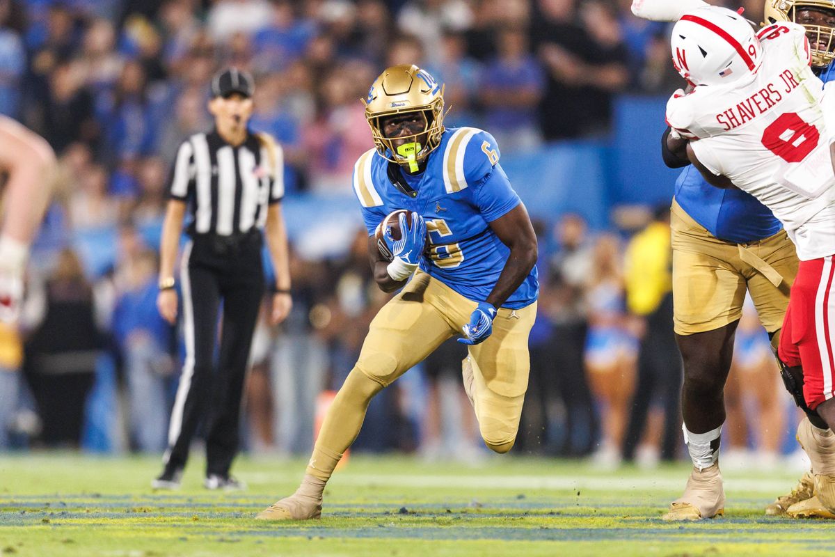 UCLA Bruins running back Anthony Woods (6) runs the ball during the game against Nebraska Cornhuskers at Rose Bowl Stadium on November 8, 2025 in Pasadena, California. 