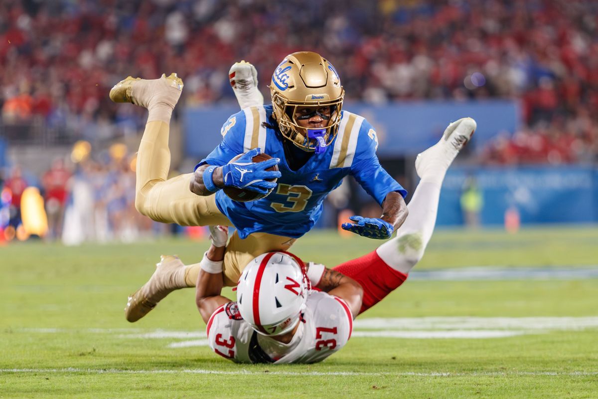 UCLA Bruins wide receiver Kwazi Gilmer (3) dives with the ball during the game against Nebraska Cornhuskers at Rose Bowl Stadium on November 8, 2025 in Pasadena, California. 