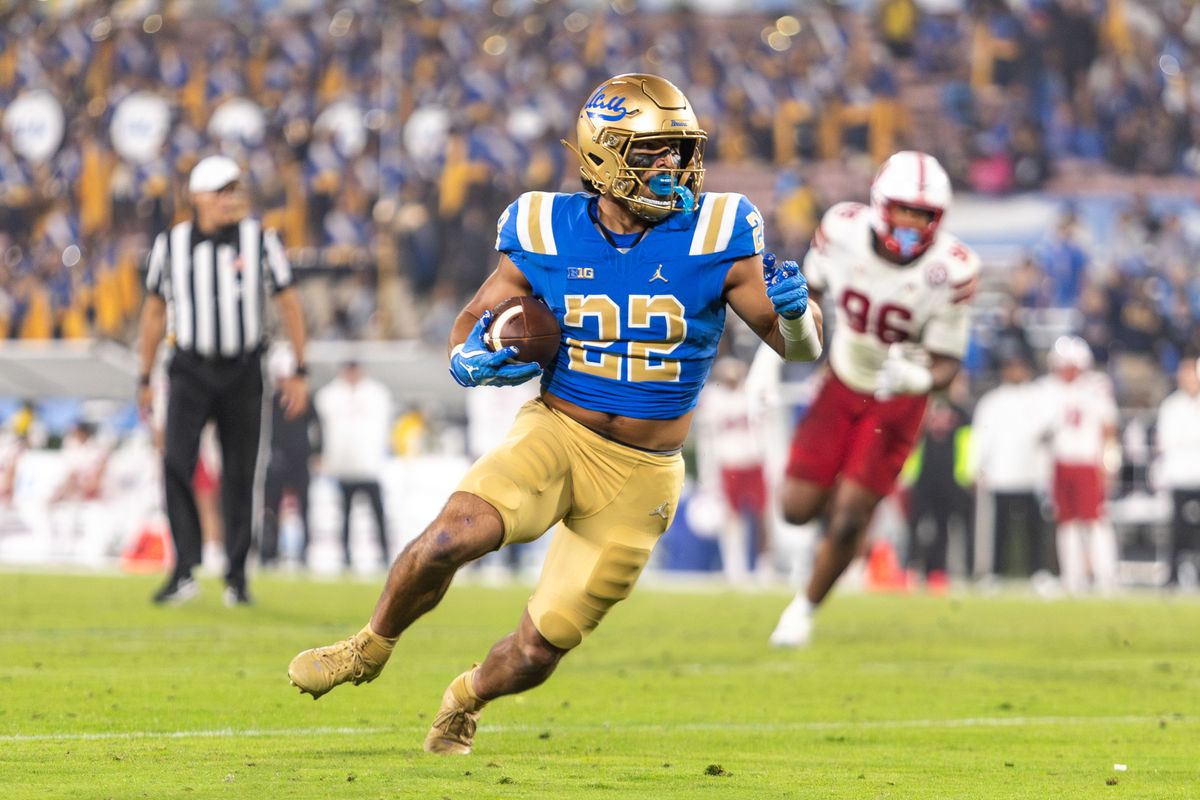 UCLA Bruins running back Anthony Frias II (22) runs in for a touchdown during the game against Nebraska Cornhuskers at Rose Bowl Stadium on November 8, 2025 in Pasadena, California. 