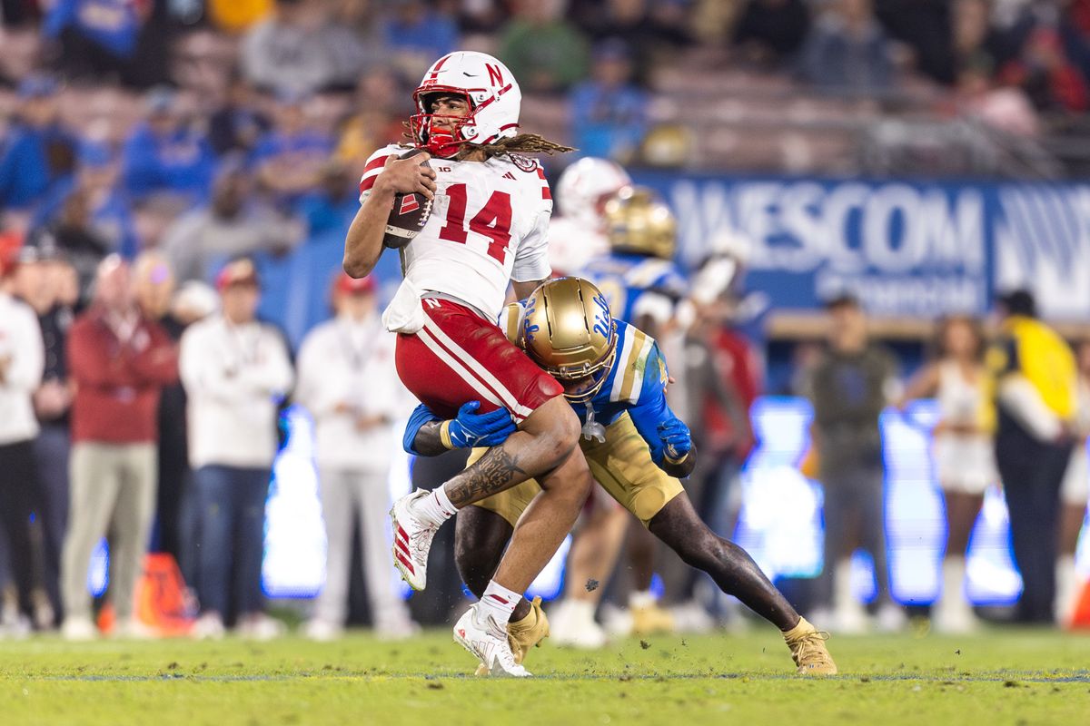 UCLA Bruins defensive back Key Lawrence (4) sacks Nebraska Cornhuskers quarterback TJ Lateef (14) during the game against Nebraska Cornhuskers at Rose Bowl Stadium on November 8, 2025 in Pasadena, California. 