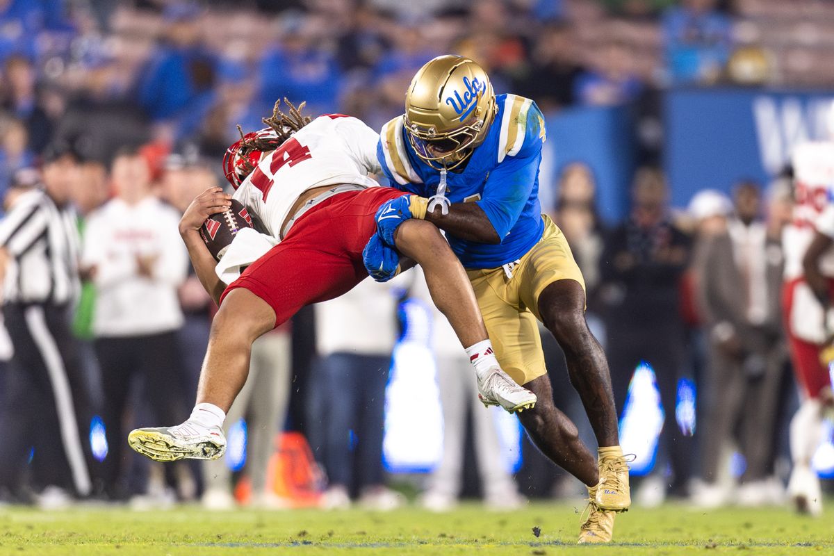 UCLA Bruins defensive back Key Lawrence (4) sacks Nebraska Cornhuskers quarterback TJ Lateef (14) during the game against Nebraska Cornhuskers at Rose Bowl Stadium on November 8, 2025 in Pasadena, California. 