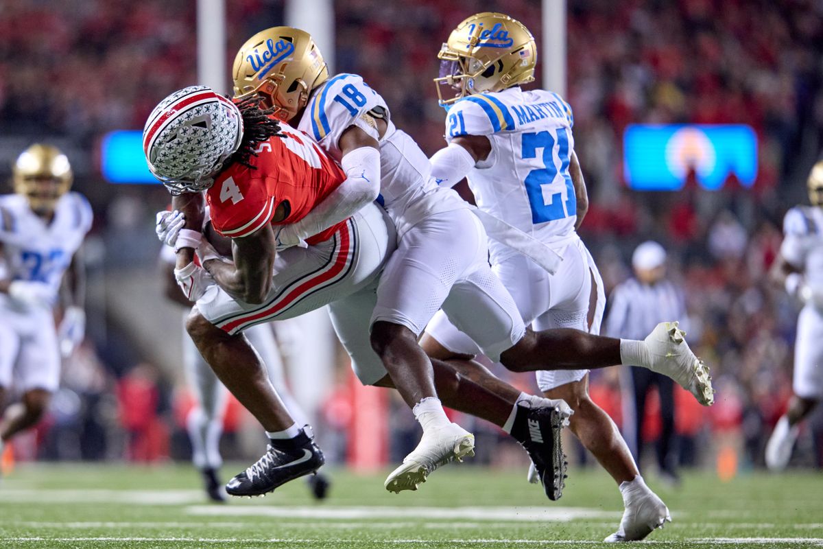 Ohio State Buckeyes wide receiver Jeremiah Smith #4 is tackled by UCLA Bruins defensive back Rodrick Pleasant #18 in the second half against the UCLA Bruins during a college football game at Ohio Stadium on November 15, 2025 in Columbus, Ohio. Ohio State Buckeyes wide receiver Jeremiah Smith #4 is tackled by UCLA Bruins defensive back Rodrick Pleasant #18 in the second half against the UCLA Bruins during a college football game at Ohio Stadium on November 15, 2025 in Columbus, Ohio.