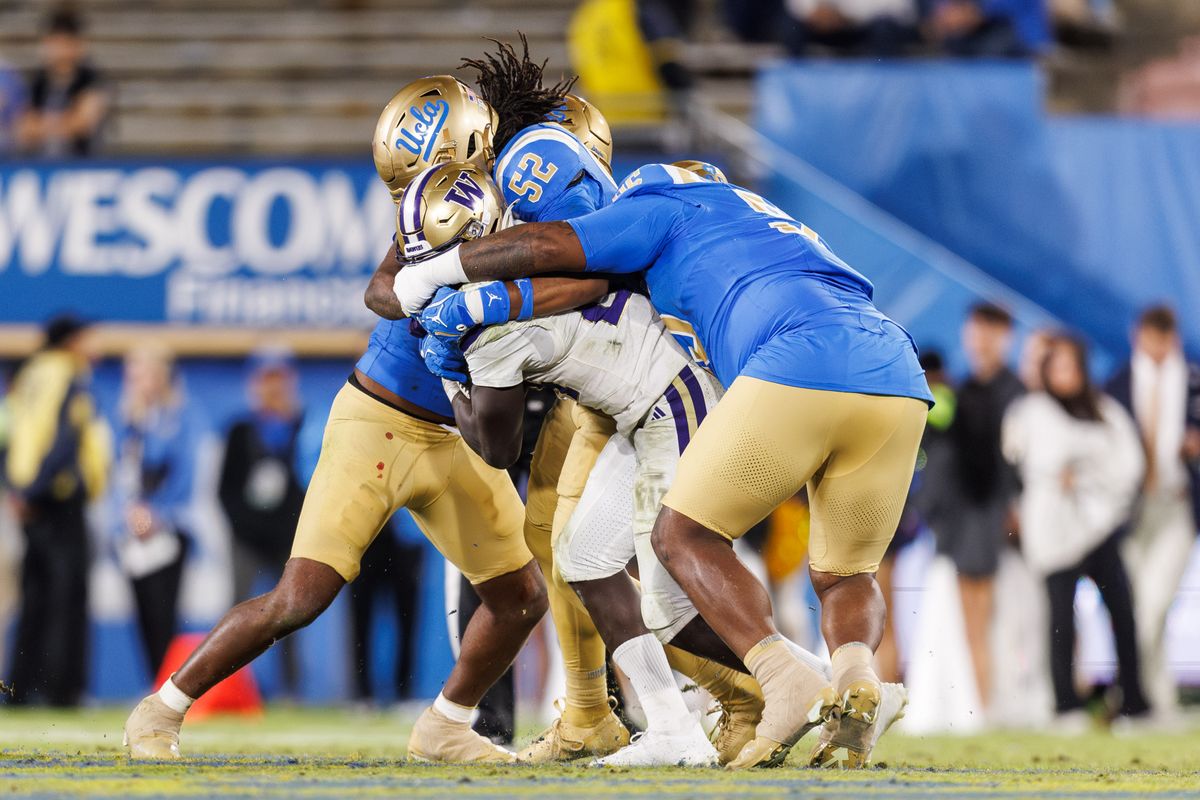 UCLA Bruins defensive lineman Jalen Hargrove (95) gets a tackle during the game against Washington Huskies at Rose Bowl Stadium on November 22, 2025 in Pasadena, California. 