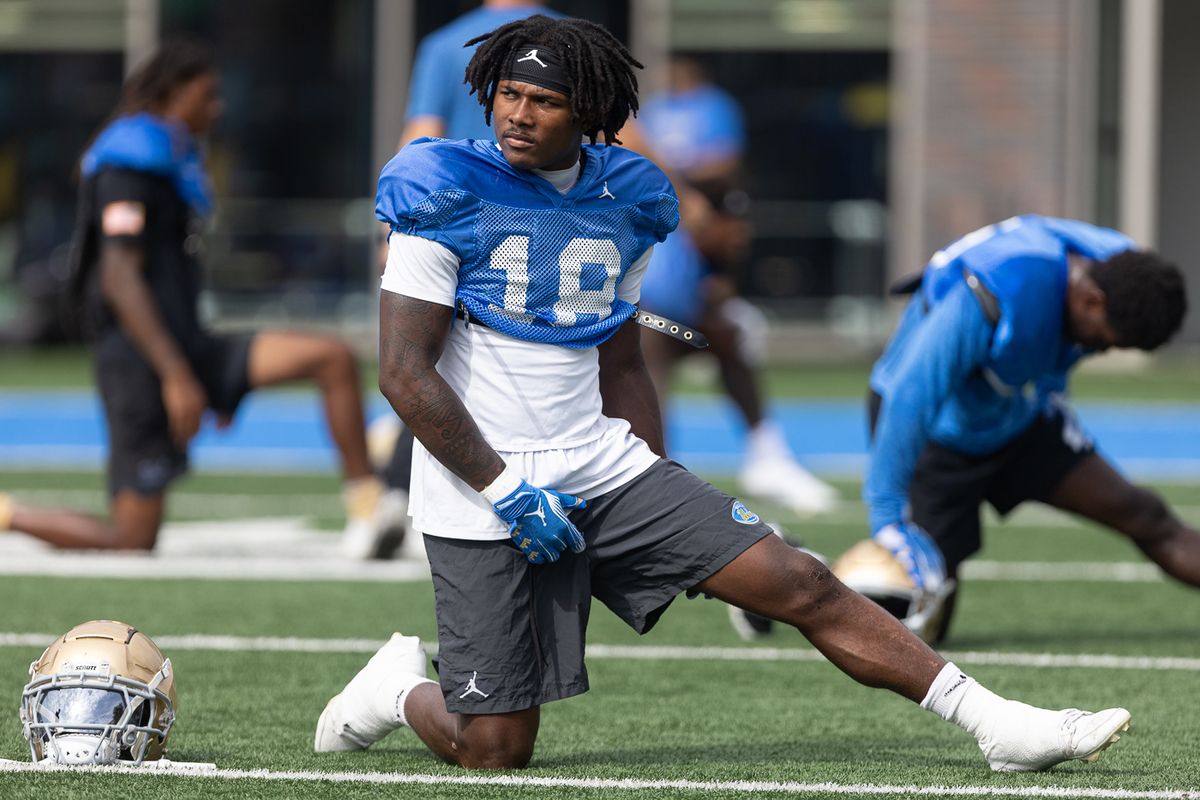 UCLA defensive back Osiris Gilbert (18) stretches during practice at Wasserman Football Center, Thursday, Aug. 27, 2026, in Los Angeles.