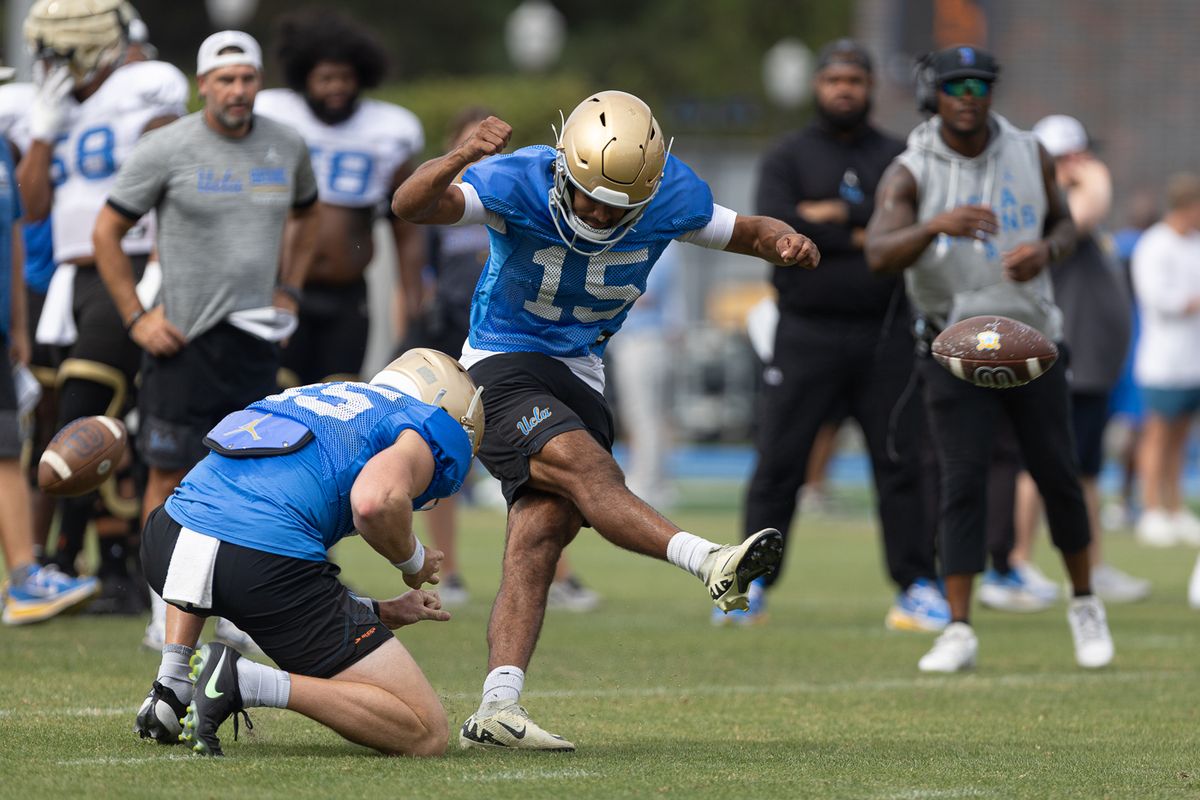 UCLA kicker Mateen Bhaghani (15) takes a kick during practice at Wasserman Football Center, Thursday, Aug. 27, 2026, in Los Angeles.