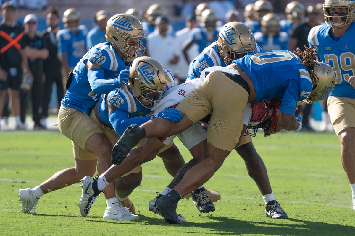 Four UCLA players swarmed the Running Back and took him down during a game against San Diego State Aztecs at Rose Bowl Stadium on September 12, 2026 in Pasadena, California. 