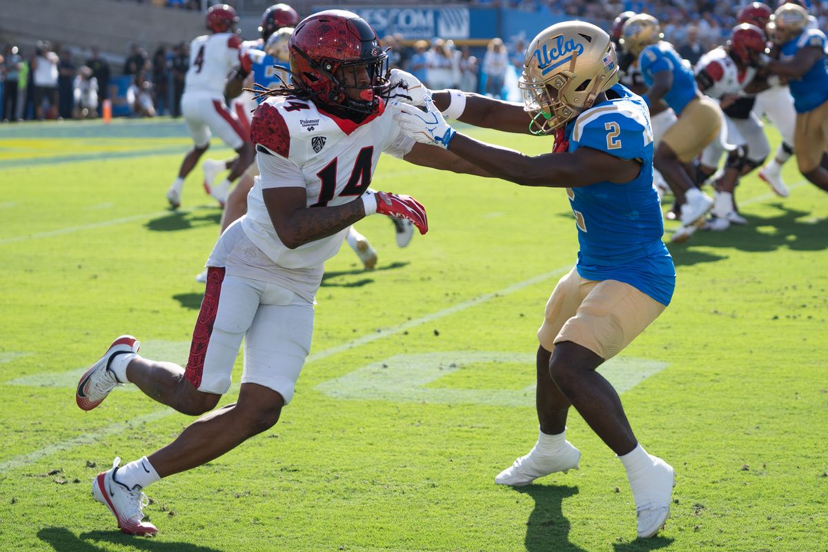 UCLA Bruins DB Rodrick Pleasant (2) pushes the WR off his route during a game against San Diego State Aztecs at Rose Bowl Stadium on September 12, 2026 in Pasadena, California. 