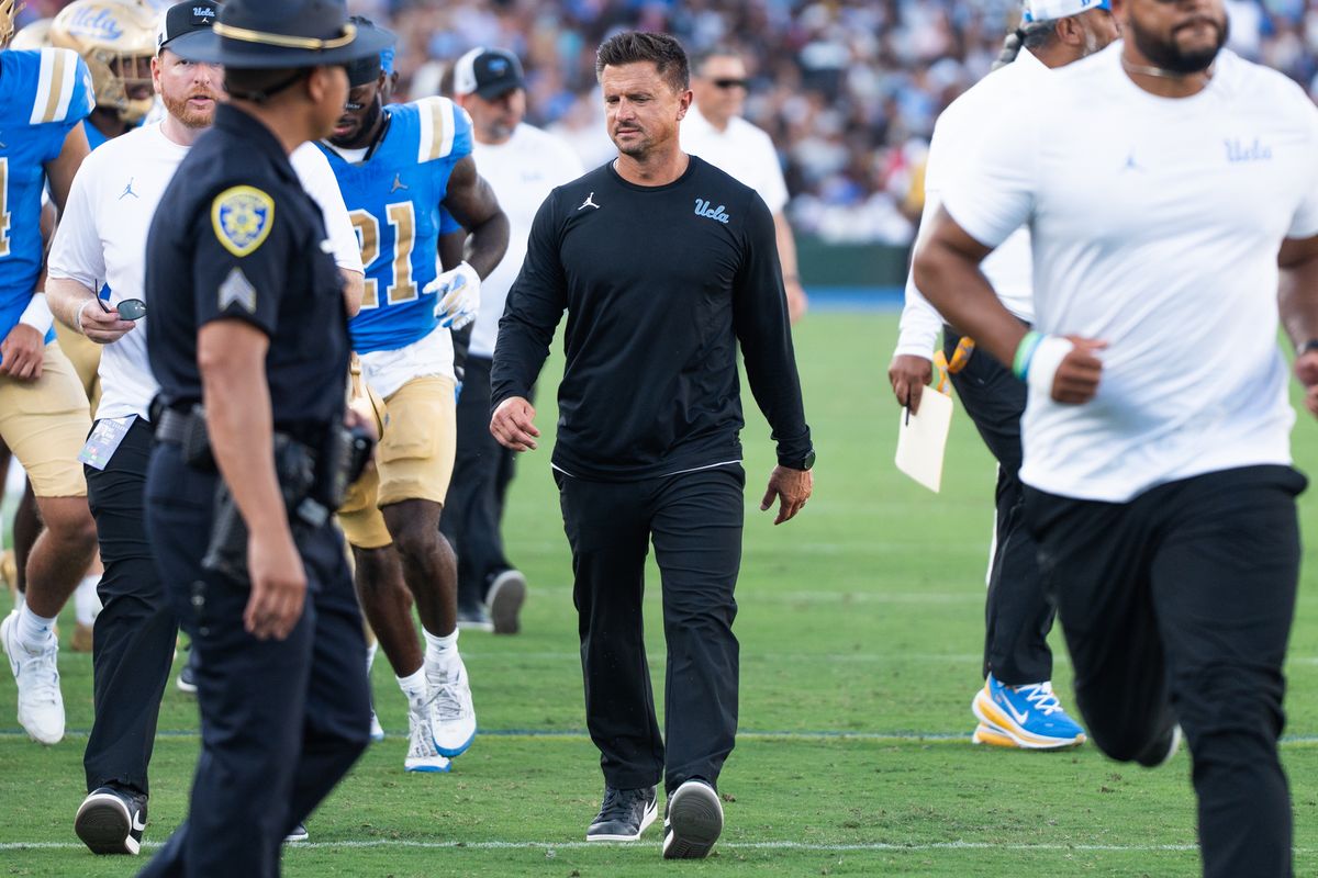 UCLA Bruins Head Coach Bob Chesney heading to the locker room after the first half of football during a game against San Diego State Aztecs at Rose Bowl Stadium on September 12, 2026 in Pasadena, California. 