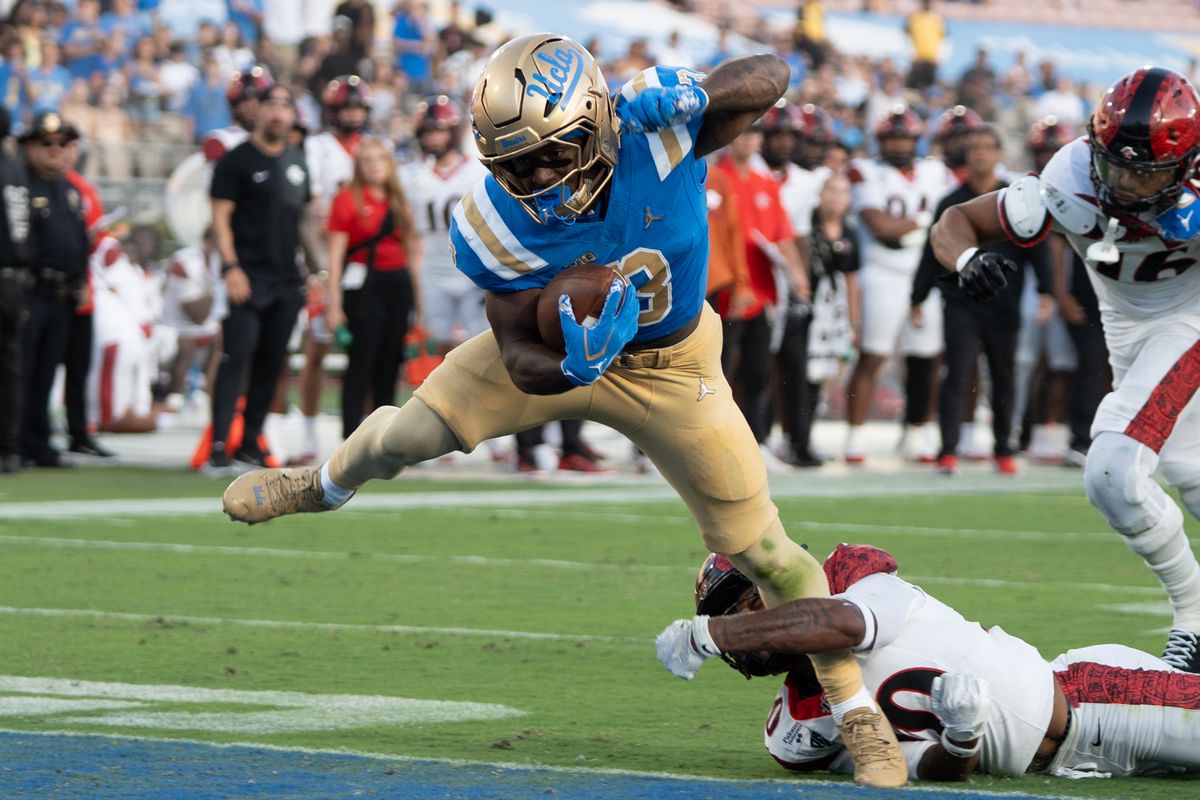 UCLA Bruins RB Wayne Knight (3) runs in for a TD while being held by his leg during a game against San Diego State Aztecs at Rose Bowl Stadium on September 12, 2026 in Pasadena, California. 