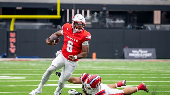 UNLV quarterback Hajj-Malik Williams (6) attempts to move downfield while avoiding Utah’s defense during college football game against Utah Tech on Saturday Sept. 7, 2024 in Las Vegas. (Kalin Sipes - The Sporting Tribune) UNLV quarterback Hajj-Malik Williams (6) attempts to move downfield while avoiding Utah’s defense during college football game against Utah Tech on Saturday Sept. 7, 2024 in Las Vegas. (Kalin Sipes - The Sporting Tribune)