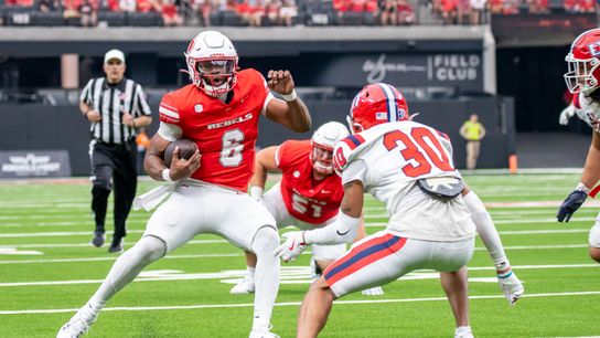 UNLV quarterback Hajj-Malik Williams (6) attempts to move downfield while avoiding Utah’s defense during college football game against Utah Tech on Saturday Sept. 7, 2024 in Las Vegas. (Kalin Sipes - The Sporting Tribune) UNLV quarterback Hajj-Malik Williams (6) attempts to move downfield while avoiding Utah’s defense during college football game against Utah Tech on Saturday Sept. 7, 2024 in Las Vegas. (Kalin Sipes - The Sporting Tribune)