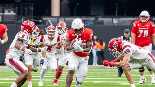 UNLV running back Kylin James (20) takes the ball downfield through Utah’s defense during college football game against Utah Tech on Saturday Sept. 7, 2024 in Las Vegas. (Kalin Sipes - The Sporting Tribune) UNLV running back Kylin James (20) takes the ball downfield through Utah’s defense during college football game against Utah Tech on Saturday Sept. 7, 2024 in Las Vegas. (Kalin Sipes - The Sporting Tribune)