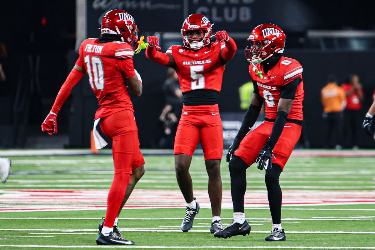 UNLV Rebels DB Tre Fulton (10), DB Quandarius Keyes (5), and DB Aamaris Brown (9) celebrate after an interception in a college football game against the Hawai'i Rainbow Warriors on Friday November 21, 2025, in Las Vegas, Nevada. 