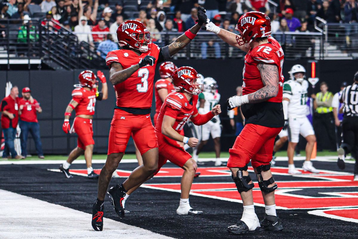 UNLV Rebels WR DaeDae Reynolds (3) and OL Will Thomas (72) celebrate after a touchdown during a college football game against the Hawai'i Rainbow Warriors on Friday November 21, 2025, in Las Vegas, Nevada. 