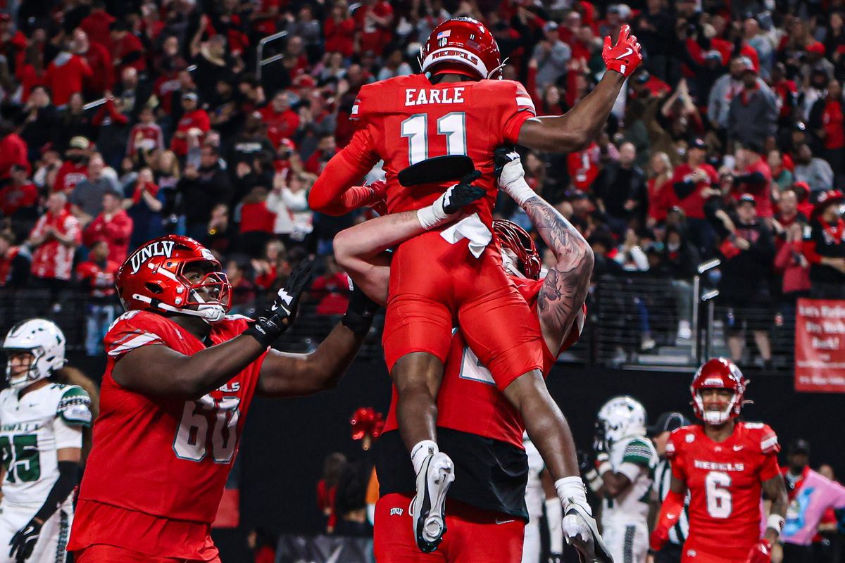 UNLV Rebels WR JoJo Earle (11) celebrates with his teammates after scoring a touchdown against the Hawai'i Rainbow Warriors on Friday November 21, 2025, in Las Vegas, Nevada. 