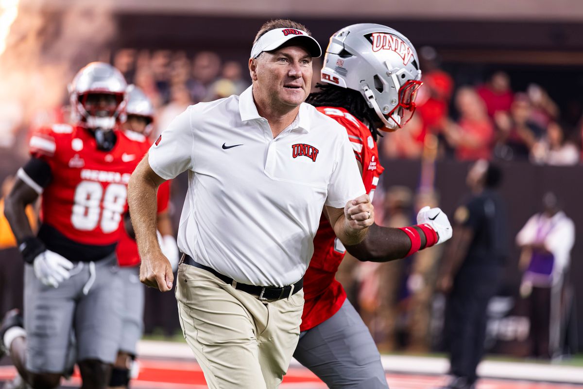 UNLV Football Head Coach Dan Mullen runs out with the team prior to the college football game against the Memphis Tigers on Friday, August 29, 2026, at Allegiant Stadium in Las Vegas, Nevada. UNLV Football Head Coach Dan Mullen runs out with the team prior to the college football game against the Memphis Tigers on Friday, August 29, 2026, at Allegiant Stadium in Las Vegas, Nevada.