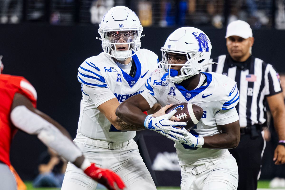 Memphis Tigers QB Marcus Stokes (2) hands the ball off to his teammate RB Jaylin Carter (6) prior to Carter’s touchdown against the UNLV Rebels on Friday, August 29, 2026, at Allegiant Stadium in Las Vegas, Nevada. Memphis Tigers QB Marcus Stokes (2) hands the ball off to his teammate RB Jaylin Carter (6) prior to Carter’s touchdown against the UNLV Rebels on Friday, August 29, 2026, at Allegiant Stadium in Las Vegas, Nevada.