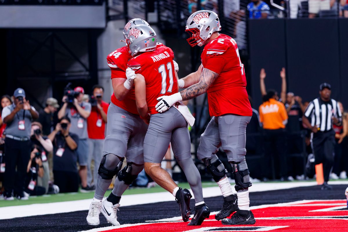 UNLV Football quarterback Jackson Arnold celebrates a touchdown with his teammates during a non-conference college football game against the Memphis Tigers on Saturday, August 29, 2026, at Allegiant Stadium in Las Vegas, NV. UNLV Football quarterback Jackson Arnold celebrates a touchdown with his teammates during a non-conference college football game against the Memphis Tigers on Saturday, August 29, 2026, at Allegiant Stadium in Las Vegas, NV.