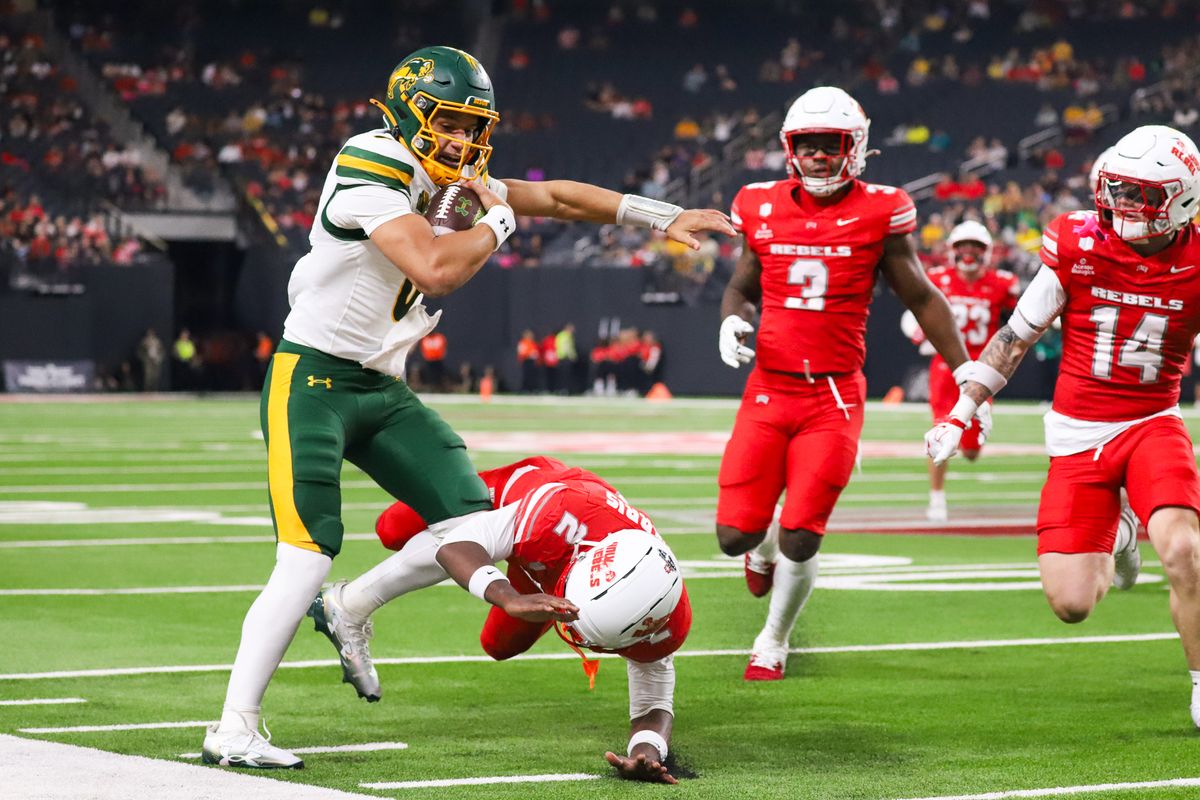 UNLV defensive back Denver Harris attempts to tackle North Dakota State quarterback Preston Brown (0) while he carries the ball downfield during first half of college football game against North Dakota State on Saturday October 10, 2026 at Allegiant Stadium in Las Vegas. UNLV defensive back Denver Harris attempts to tackle North Dakota State quarterback Preston Brown (0) while he carries the ball downfield during first half of college football game against North Dakota State on Saturday October 10, 2026 at Allegiant Stadium in Las Vegas.