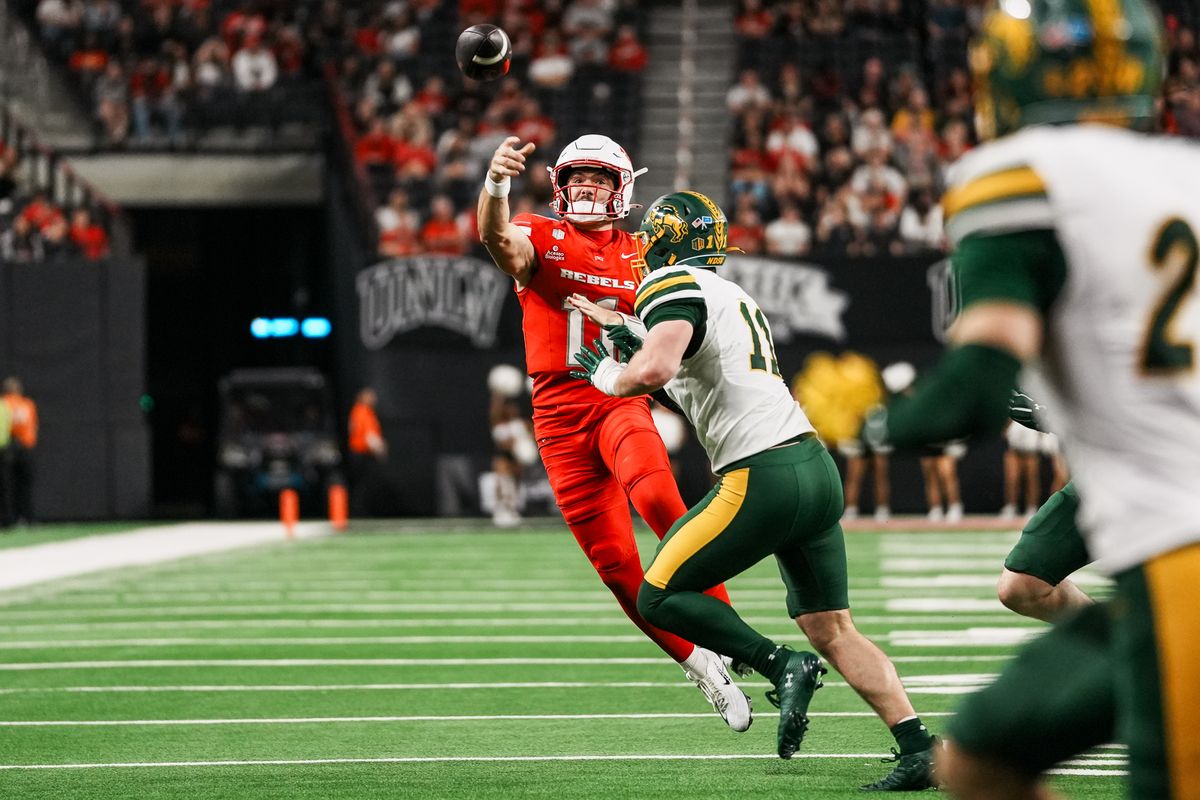 UNLV quarterback Jackson Arnold (11) passes the ball over North Dakota State defensive end Matthew Stenbroten (11) during second half of college football game against North Dakota State on Saturday October 10, 2026 at Allegiant Stadium in Las Vegas. UNLV quarterback Jackson Arnold (11) passes the ball over North Dakota State defensive end Matthew Stenbroten (11) during second half of college football game against North Dakota State on Saturday October 10, 2026 at Allegiant Stadium in Las Vegas.