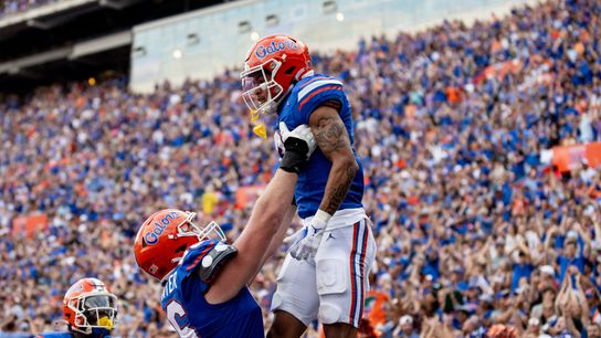 Florida Gators offensive lineman Jake Slaughter (66) holds up Florida Gators wide receiver Eugene Wilson III (3) after a touchdown during the second half at Steve Spurrier Field at Ben Hill Griffin Stadium in Gainesville, FL on Saturday, October 7, 2023. [Matt Pendleton/Gainesville Sun]