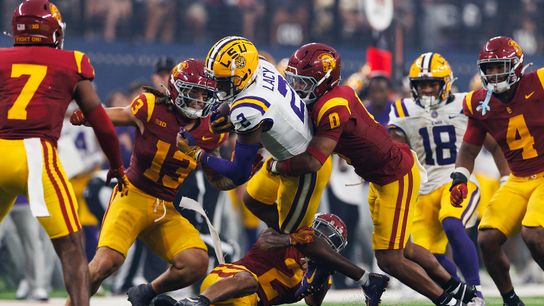 Akili Arnold #0 of the USC Trojans tackles Kyren Lacy #2 of the LSU Tigers during the Modelo Vegas Kickoff Classic at Allegiant Stadium on September 1, 2024 in Las Vegas, Nevada. Akili Arnold #0 of the USC Trojans tackles Kyren Lacy #2 of the LSU Tigers during the Modelo Vegas Kickoff Classic at Allegiant Stadium on September 1, 2024 in Las Vegas, Nevada.
