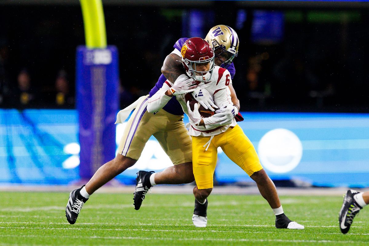 USC Trojans wide receiver Makai Lemon #6 is tackled during the first half against Washington Huskies at Husky Stadium on November 2, 2024 in Seattle, Washington.